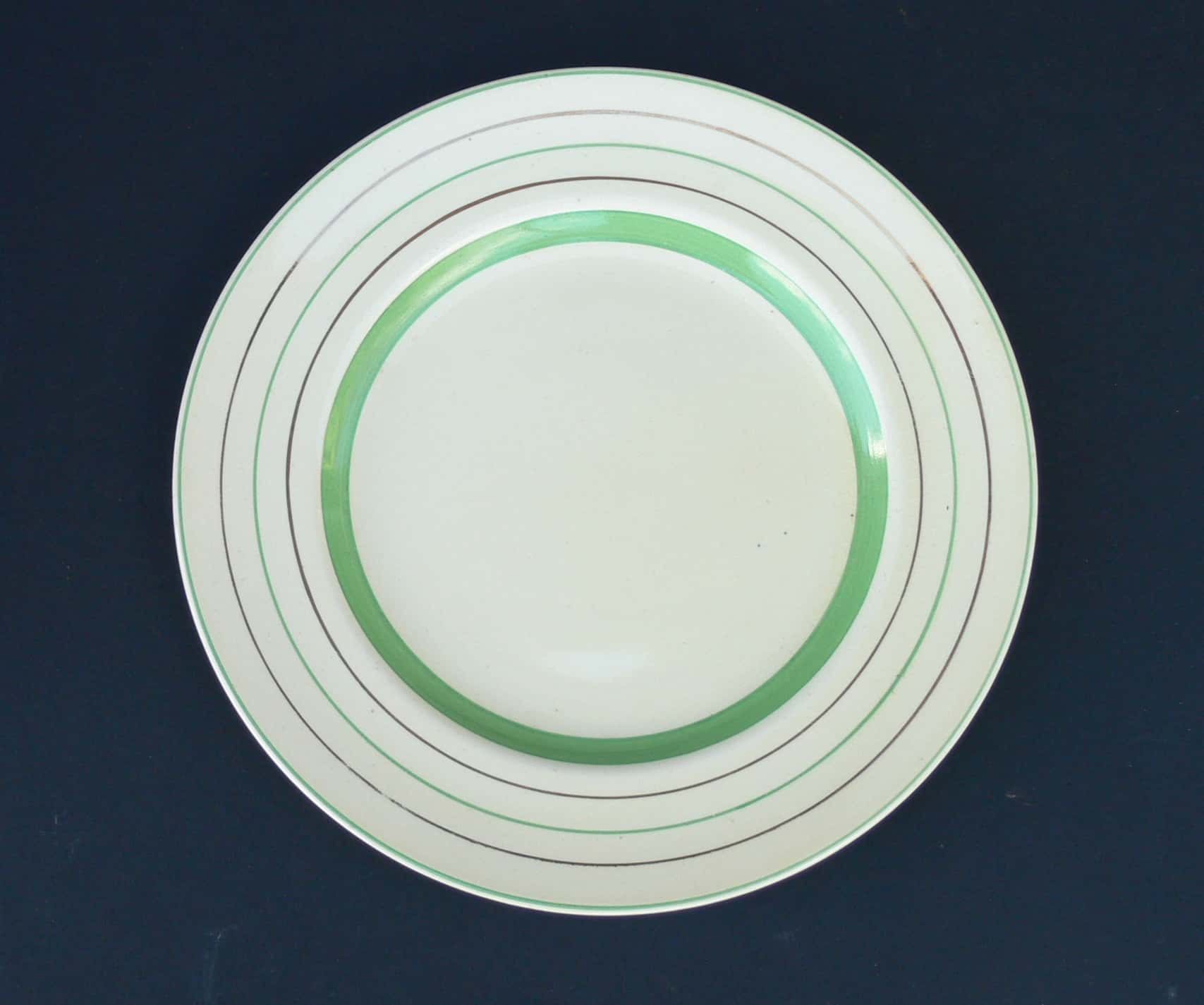 Three Clarice Cliff Banded Tea Plates